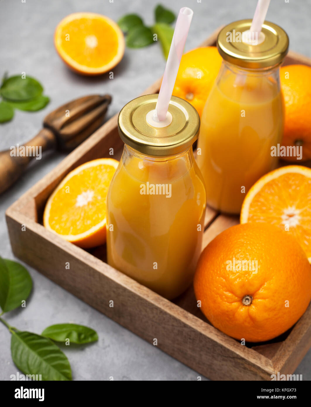 Glass Bottle of Fresh Orange Juice with Fresh Fruits and Flowers Vase on  Wooden Planks Table Stock Photo - Image of fruit, fresh: 239025358