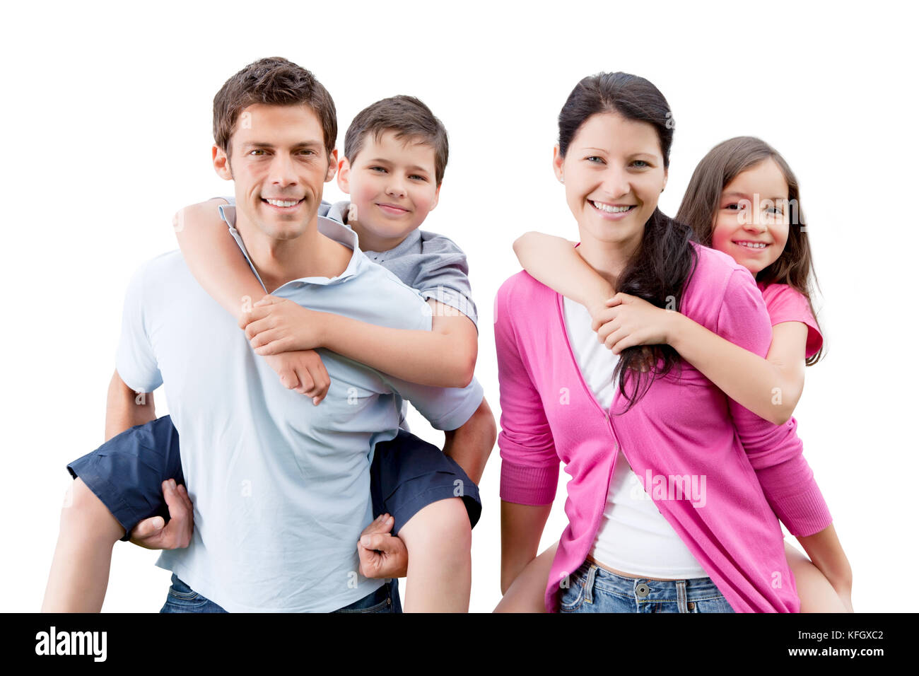 Portrait of happy parents piggybacking children against white background Stock Photo