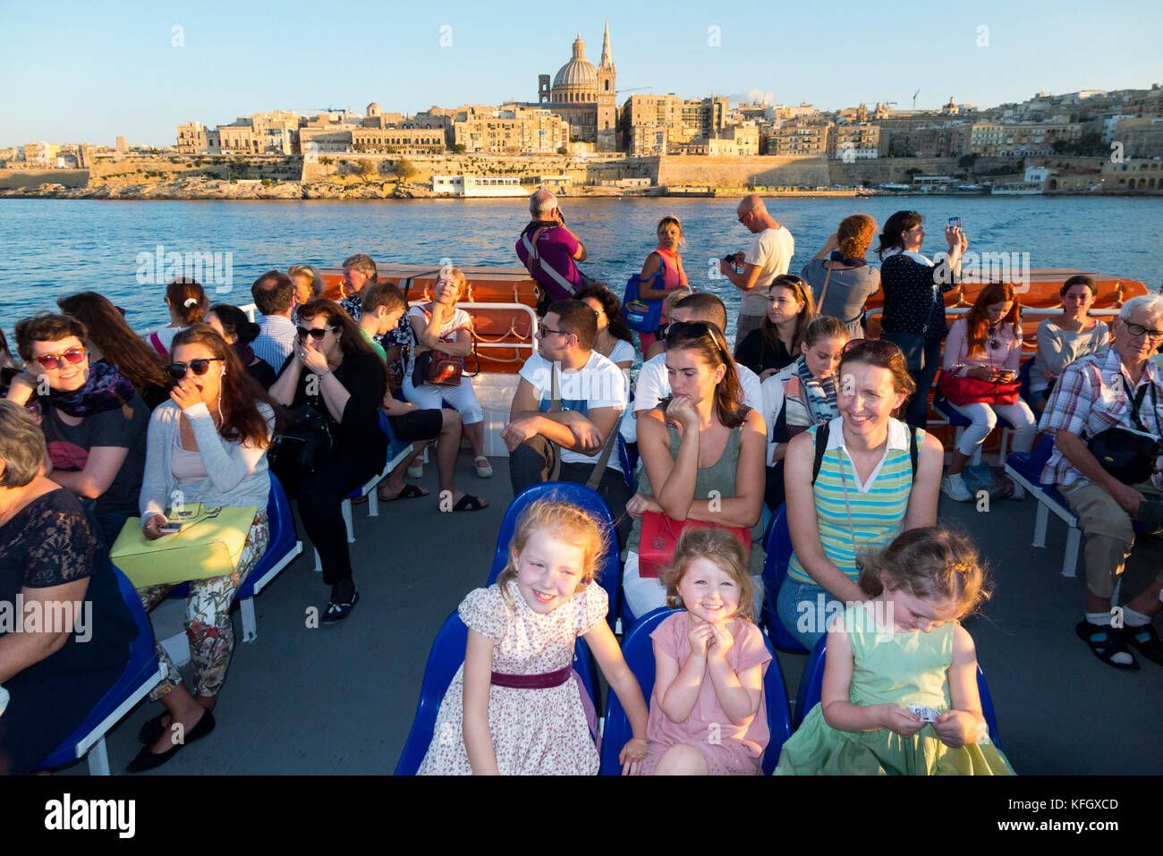 The Valletta / Sliema passenger Ferry ' Top Cat One ' with the Valletta skyline in the background. Malta. (91) Stock Photo