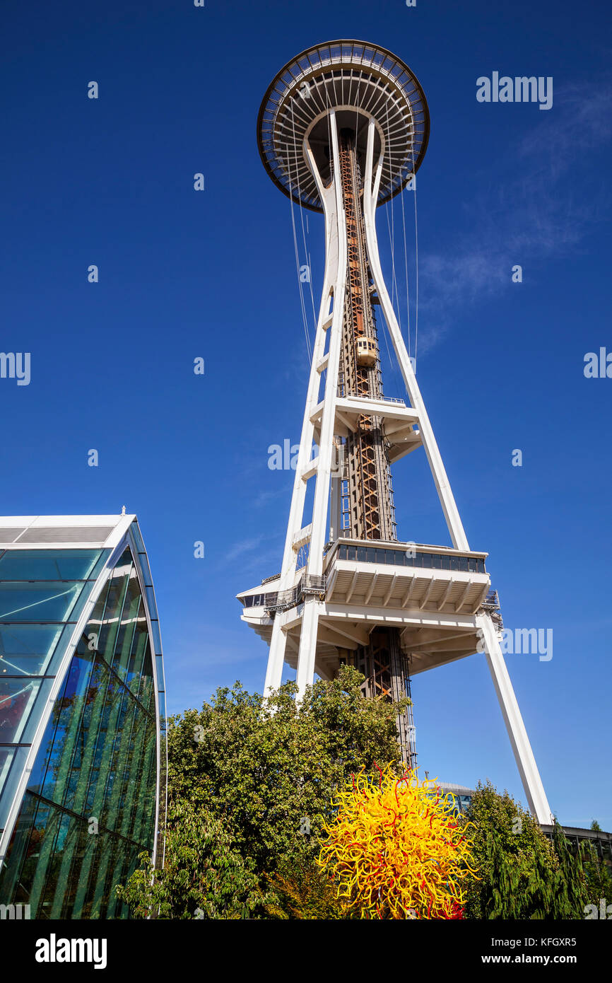 WA14137-00...WASHINGTON - View of glass work and the Space Needle from the Chihuly Garden And Glass located in the Seattle Center.Vertical tall Stock Photo