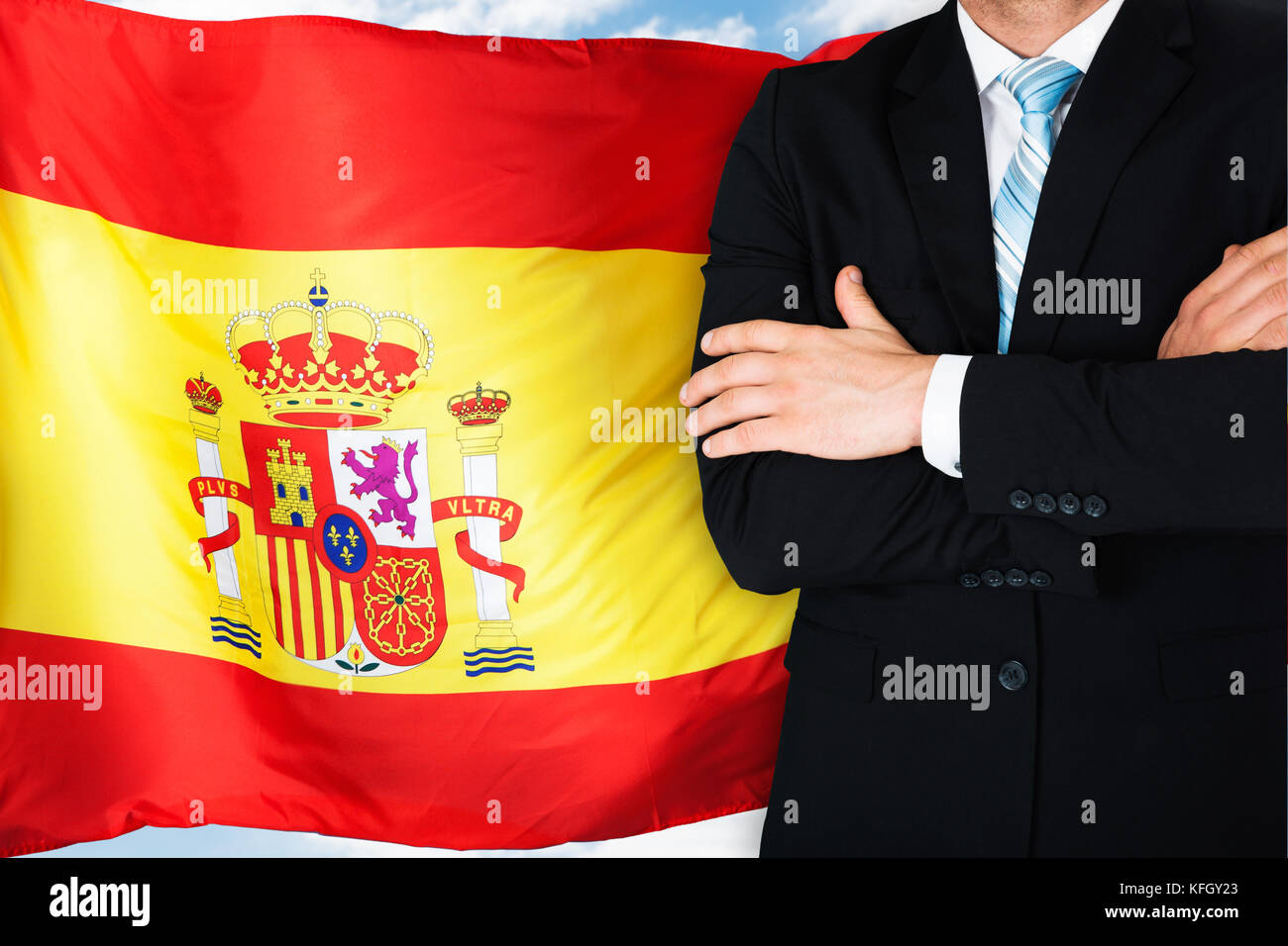 Close-up Of Businessman In Front Of Spanish Flag Stock Photo