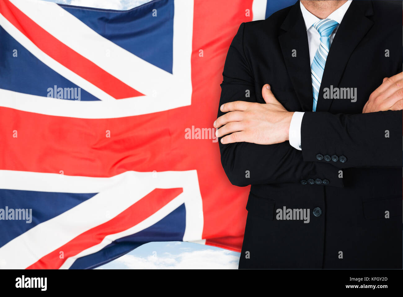 Close-up Of Businessman In Front Of British Flag Stock Photo