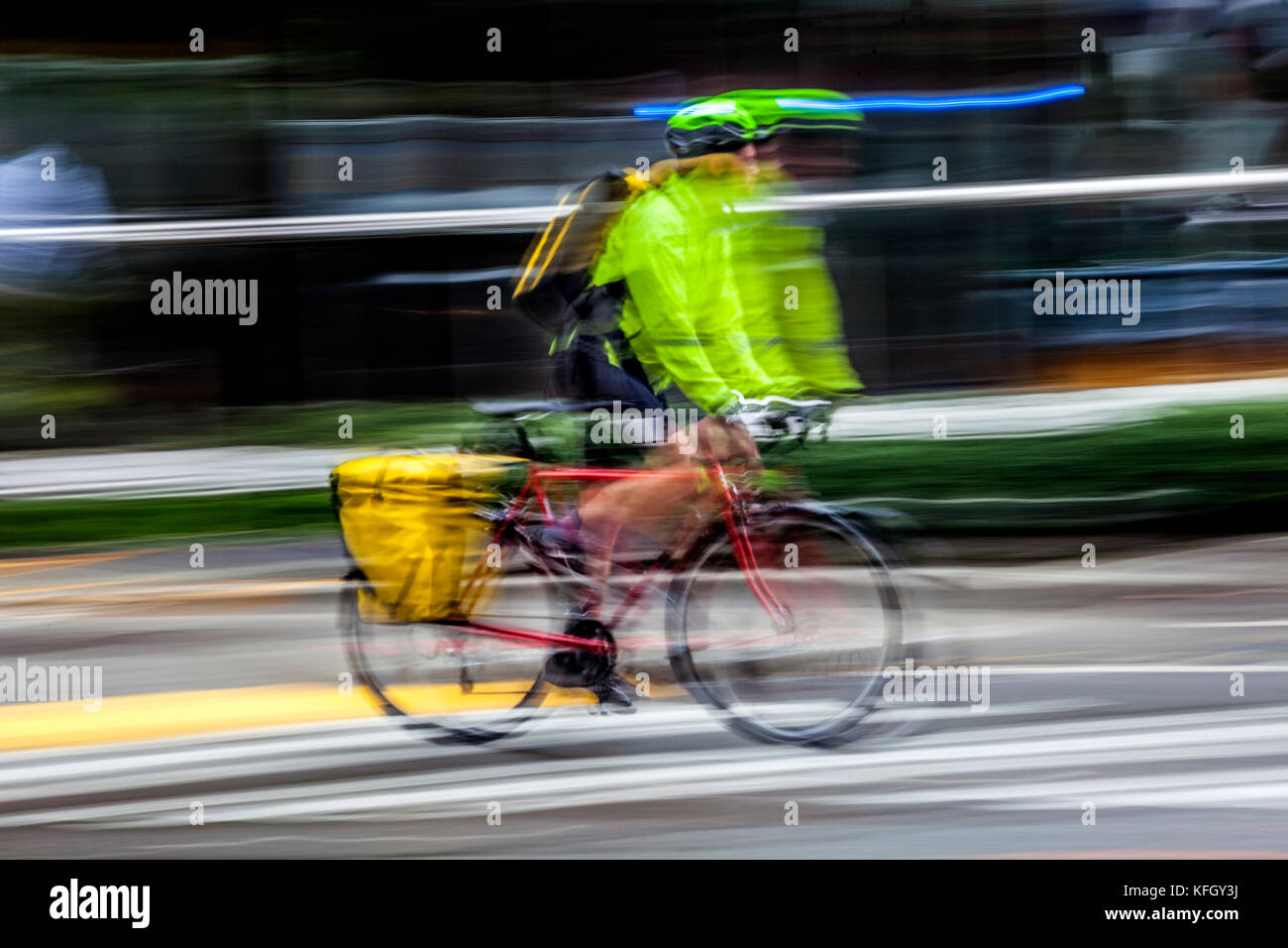 WA14185-00...WASHINGTON - Bicycle ridder on a wet day in down town Seattle. (No MR) Stock Photo