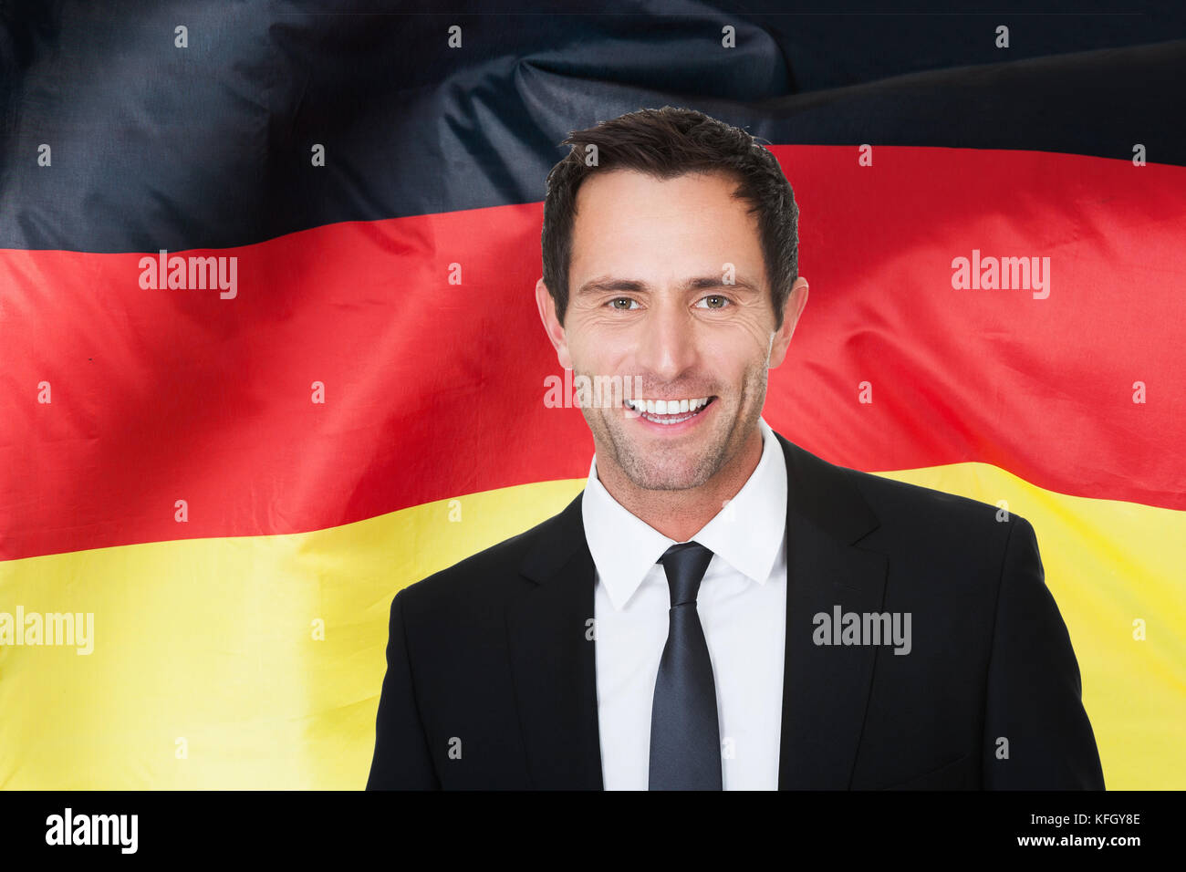 Portrait Of Happy Businessman In Front Of German Flag Stock Photo Alamy