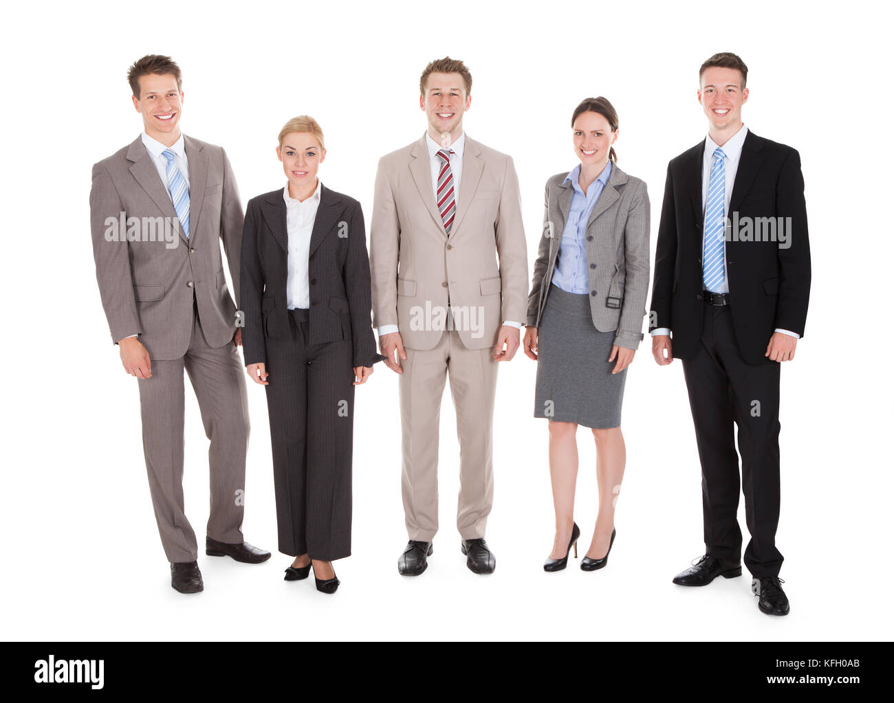 Full length portrait of confident young business people standing isolated over white background Stock Photo