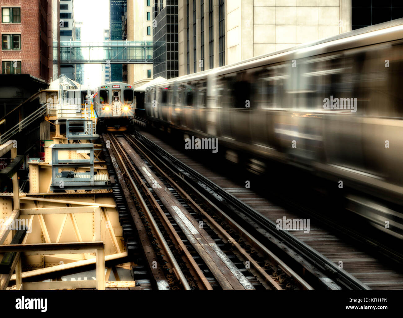 Moving Train on elevated tracks within buildings at the Loop, Glass and ...