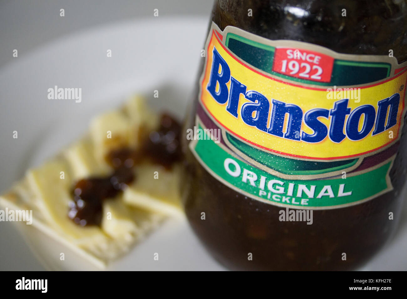 A Jar of Original Branston Pickle,with a cheese cracker by its side