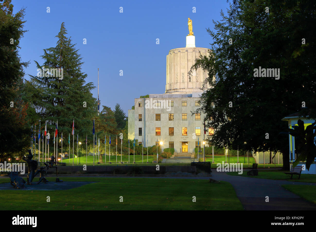USA, Oregon, Salem, Oregon State Capitol from Wilson Park with Walk of Flags Stock Photo