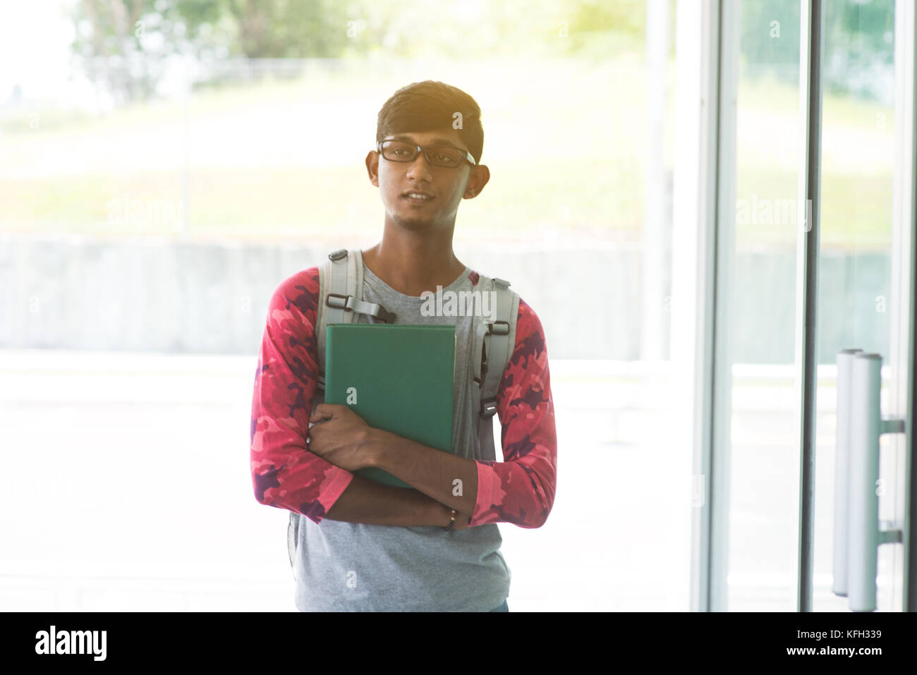 Indian teenage male holding hi-res stock photography and images - Alamy