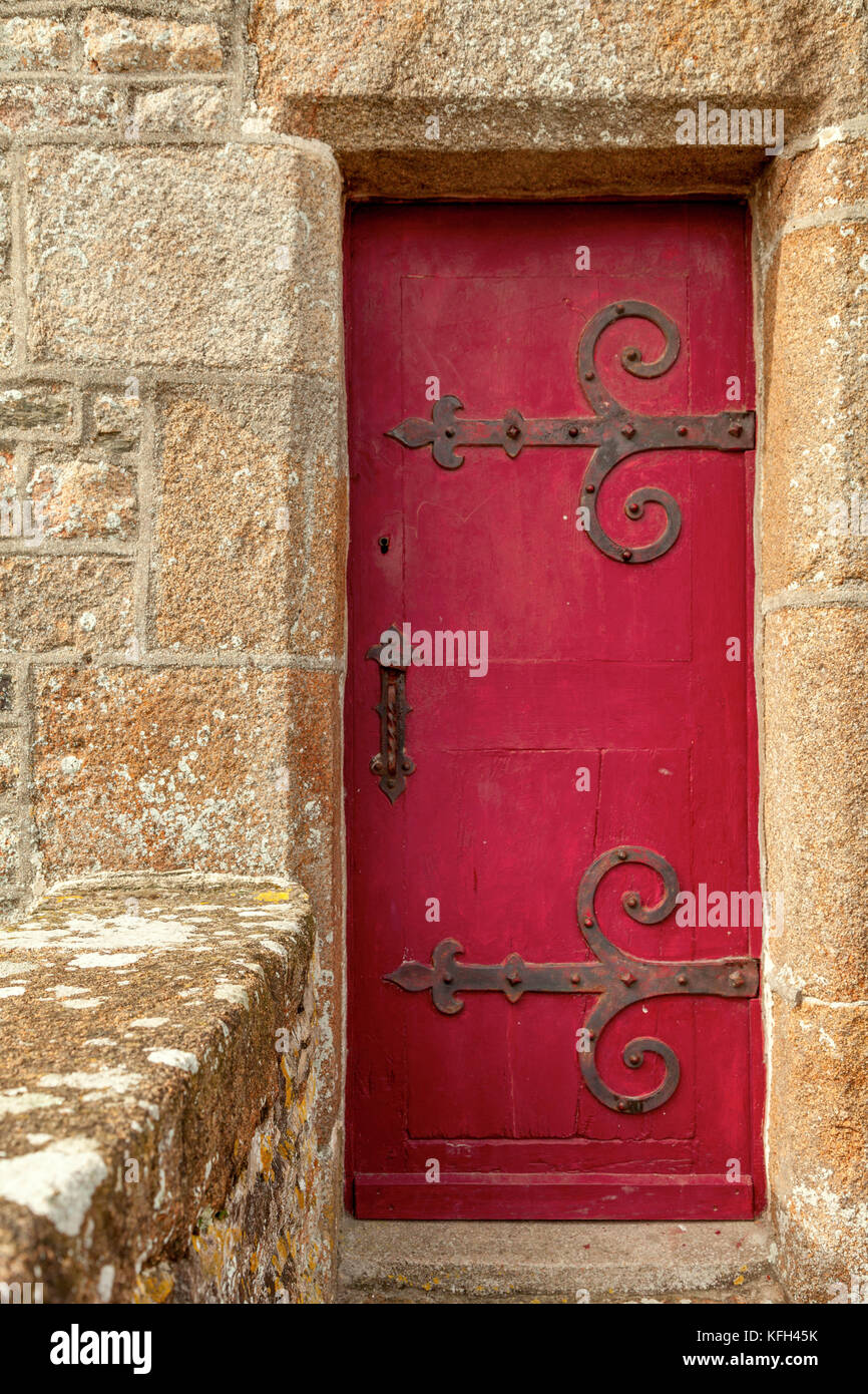 Old wooden door in stone doorway Mont Saint-Michel Normandy France Stock Photo