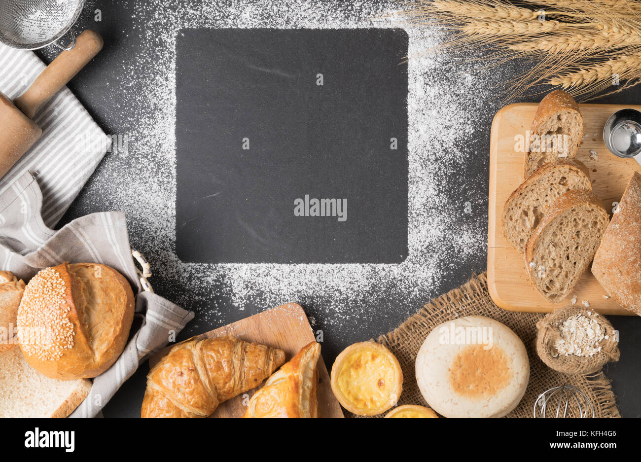 flour powder and bakerys with ingredients on black background, top view ...