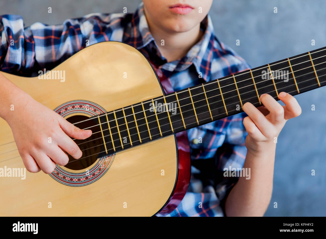 Cute teen boy with acoustic guitar Stock Photo