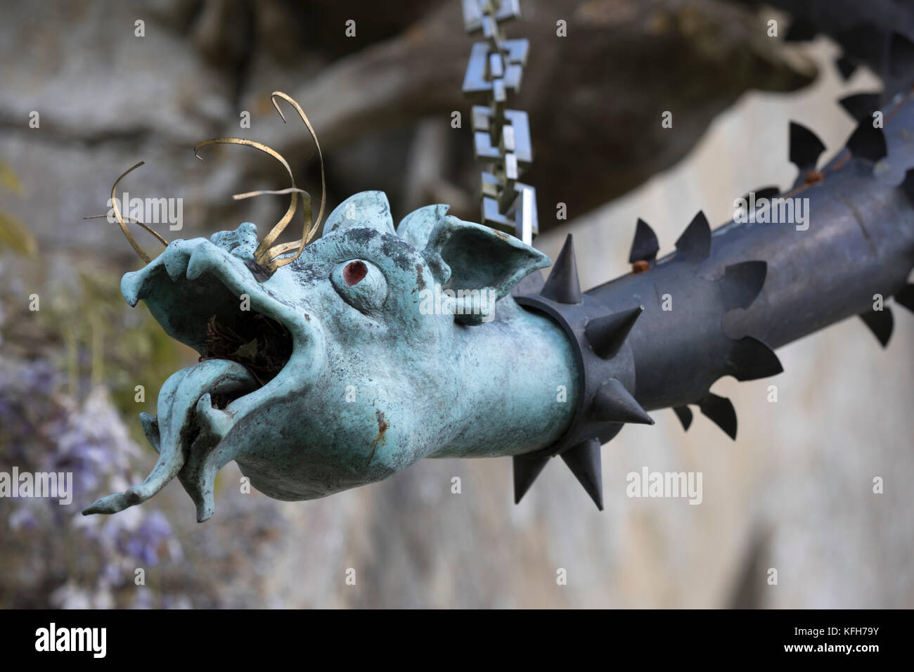 Dragon faced drain pipe on exterior of St Nicholas's church, Hatherop