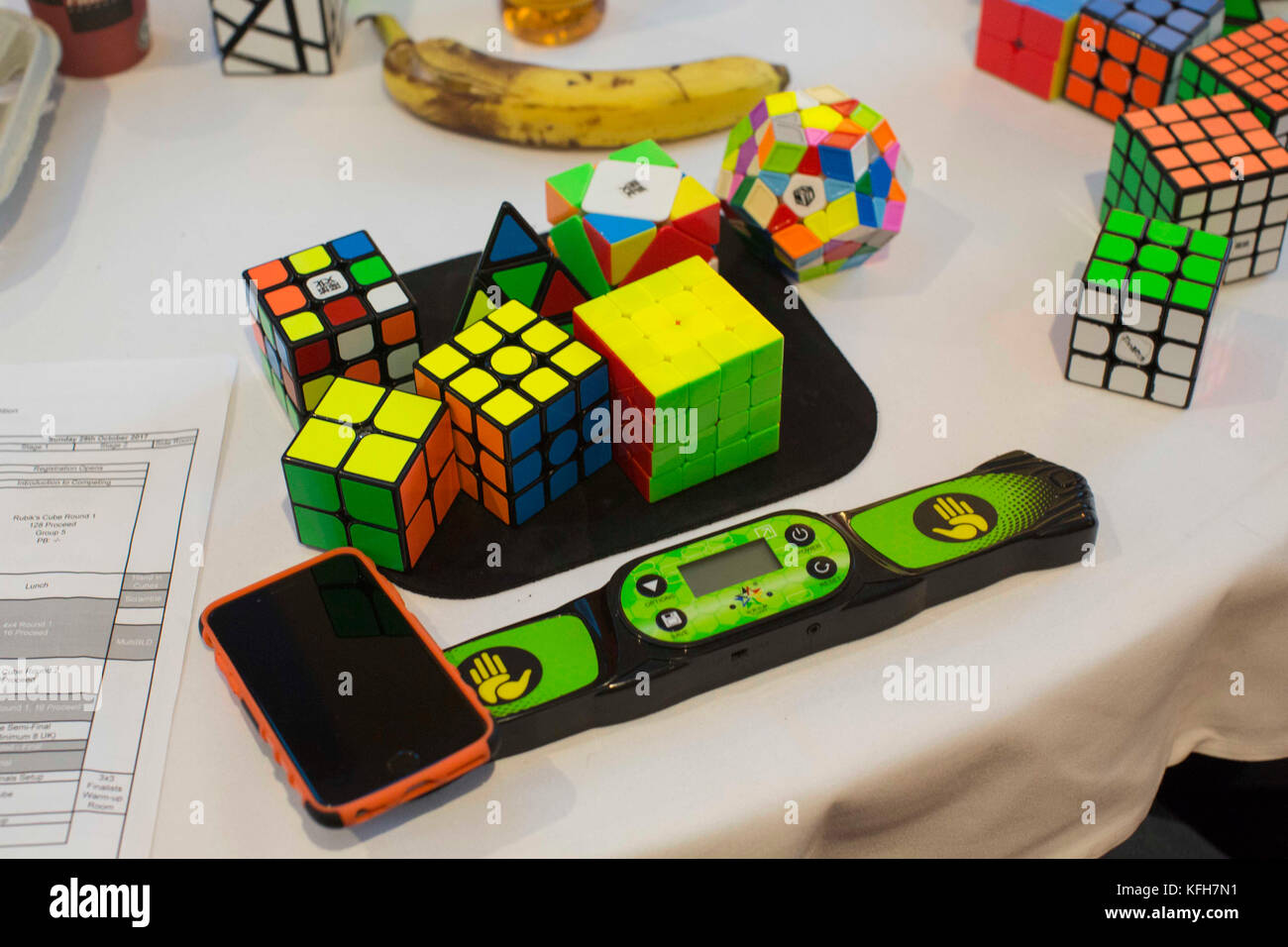A variety of different Rubik's Cubes and a timer rest on table the the Rubik Speedcubing UK Championship at The Forum in Stevenage, Hertfordshire Stock Photo - Alamy