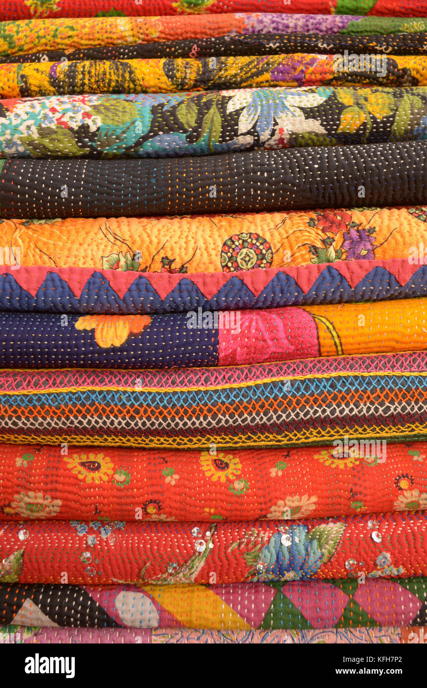Stack of embroidered and applique textiles from Rajahstan, India Stock Photo