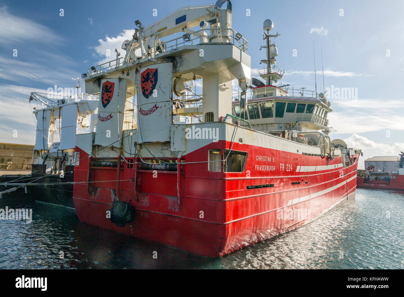 A mixture of different designs and sizes of fishing vessels in Fraserburgh harbour, Aberdeenshire, Scotland, UK Stock Photo