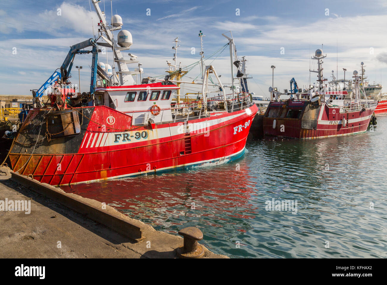 A mixture of different designs and sizes of fishing vessels in ...