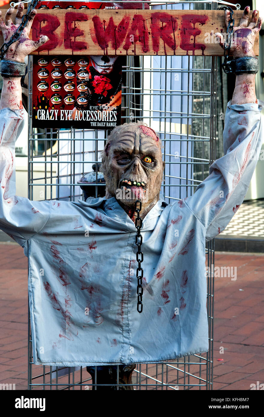 Zombie dummy chained outside a shop for Halloween in the North Laine shopping area of Brighton, England. Stock Photo