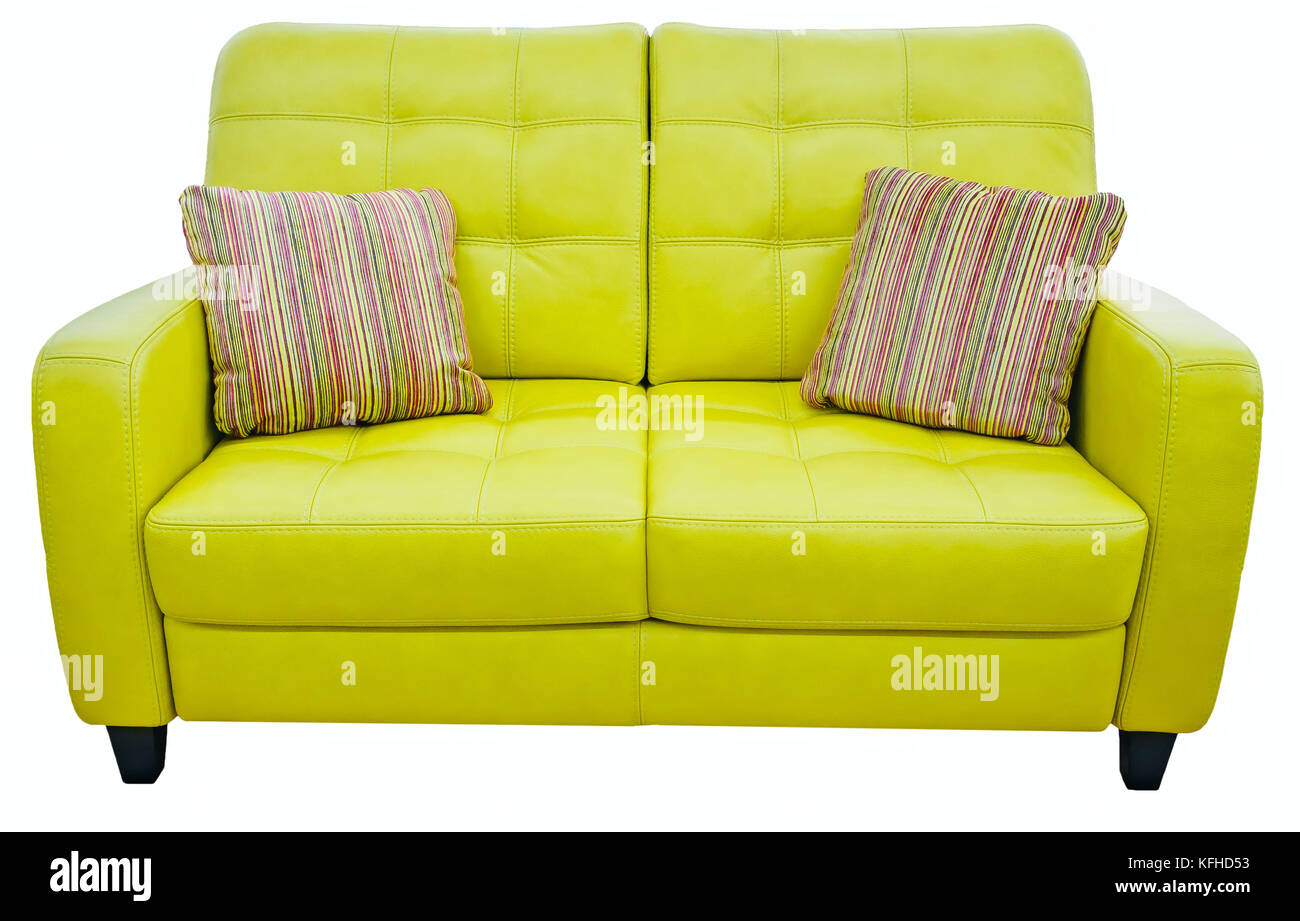 Green lime sofa with pillow. Soft lemon couch. Classic pistachio divan on isolated background Stock Photo