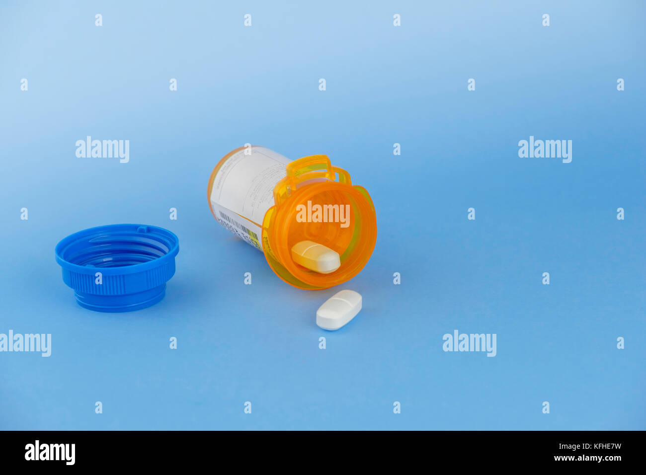 Two prescription pills from a bottle of Amoxik, generic antibiotic for Augmentin. 875 MG TAB. USA. Stock Photo