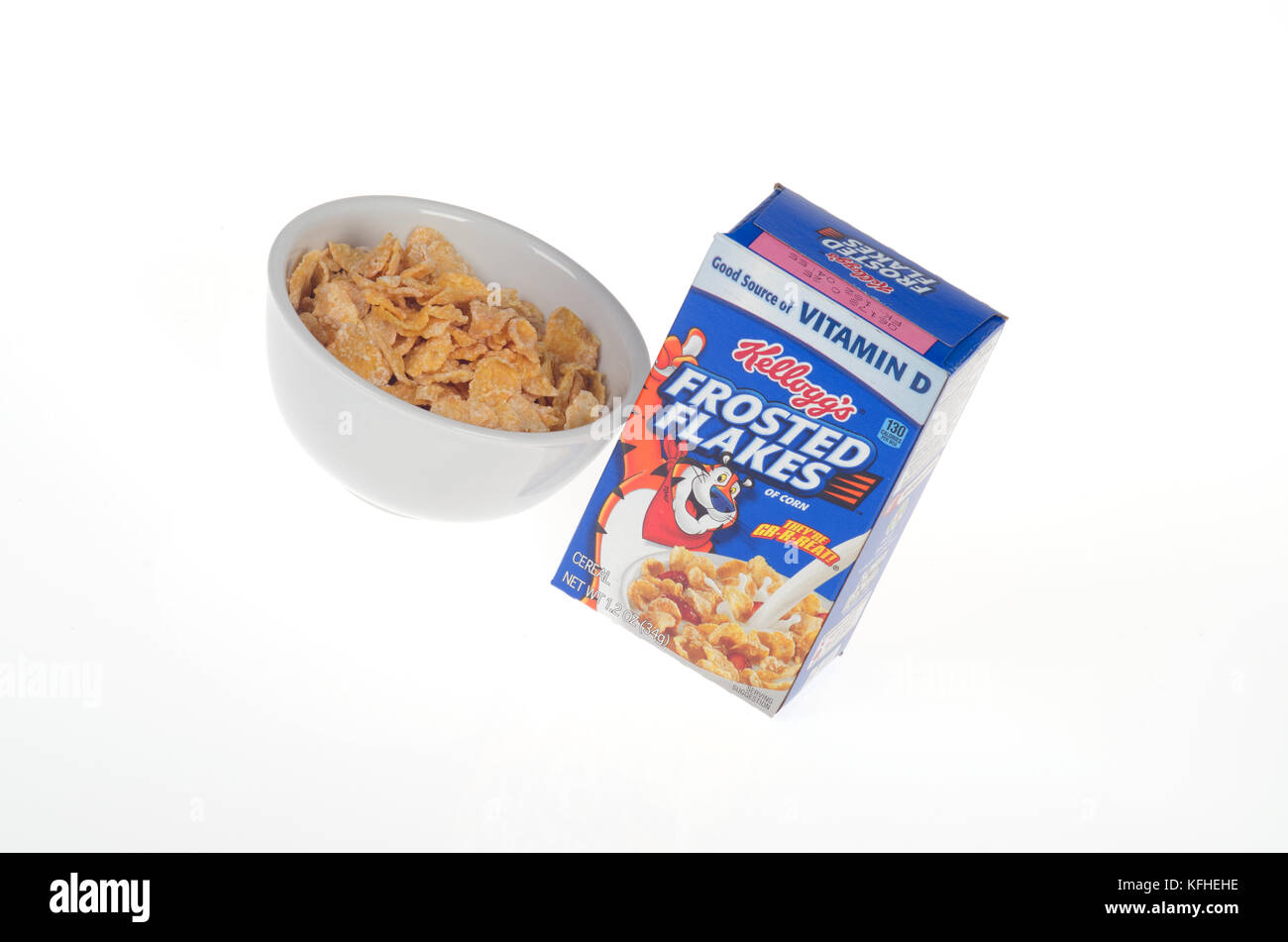 Kellogg's Frosted Flakes cereal box and bowl Stock Photo