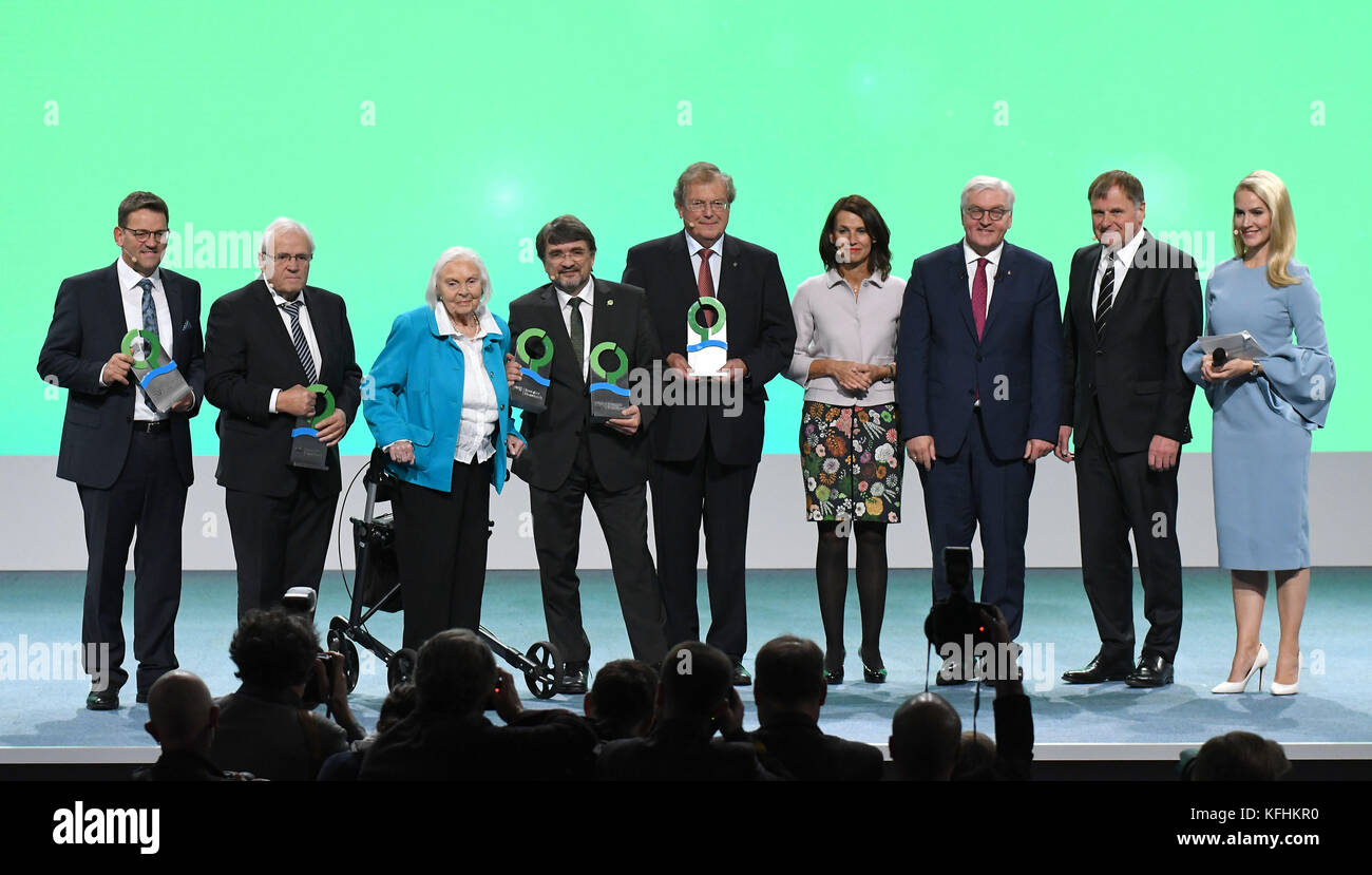 Award winners Johannes (l-r) and Bernhard Oswald (Torquemotoren), Inge Sielmann, Kai Frobel, Hubert Weiger (Gruenes Band), the chairwoman of the DBU board of trustees Rita Schwarzeluehr-Sutter, German President Frank-Walter Steinmeier, the deputy secretary general of the DBU Werner Wahmhoff and host Judith Rakers stand on stage during the ceremony of the German Environment Award ('Deutscher Umweltpreis') of the German Federal Foundation for the Environment ('Deutsche Bundesstiftung Umwelt') in Braunschweig, Germany, 29 October 2017. The awards is endowed with 500,000 Euro, making it the highes Stock Photo