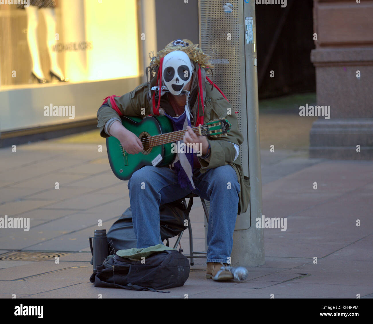 Glasgow, Scotland, UK. 29th October. Busker with green guitar and mask. Halloween on the streets of the city present some everyday sights differently. Credit Gerard Ferry/Alamy news Stock Photo