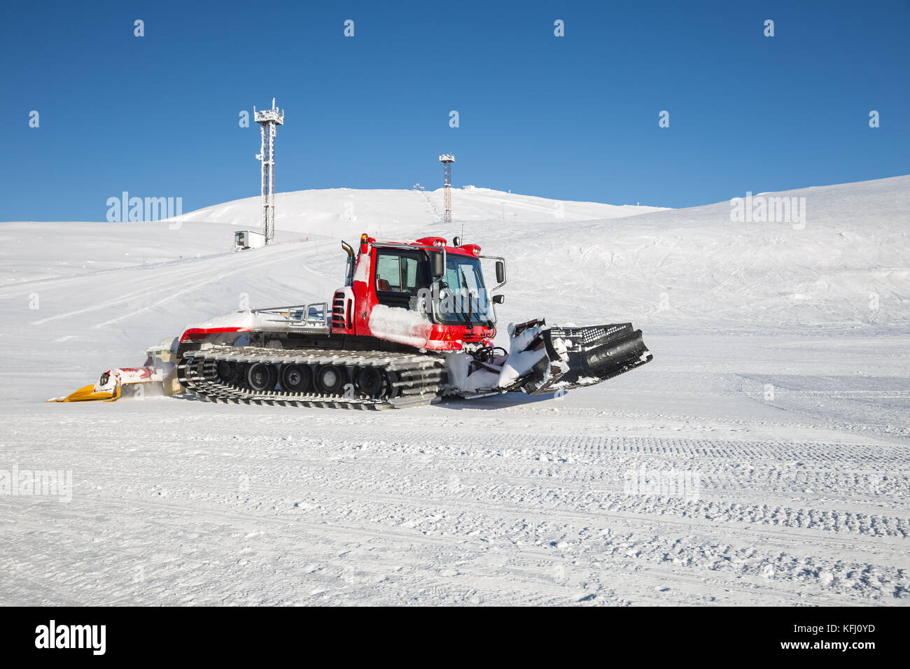Snow groomer prepares the ski slope at a ski resort in the Khibiny Stock Photo