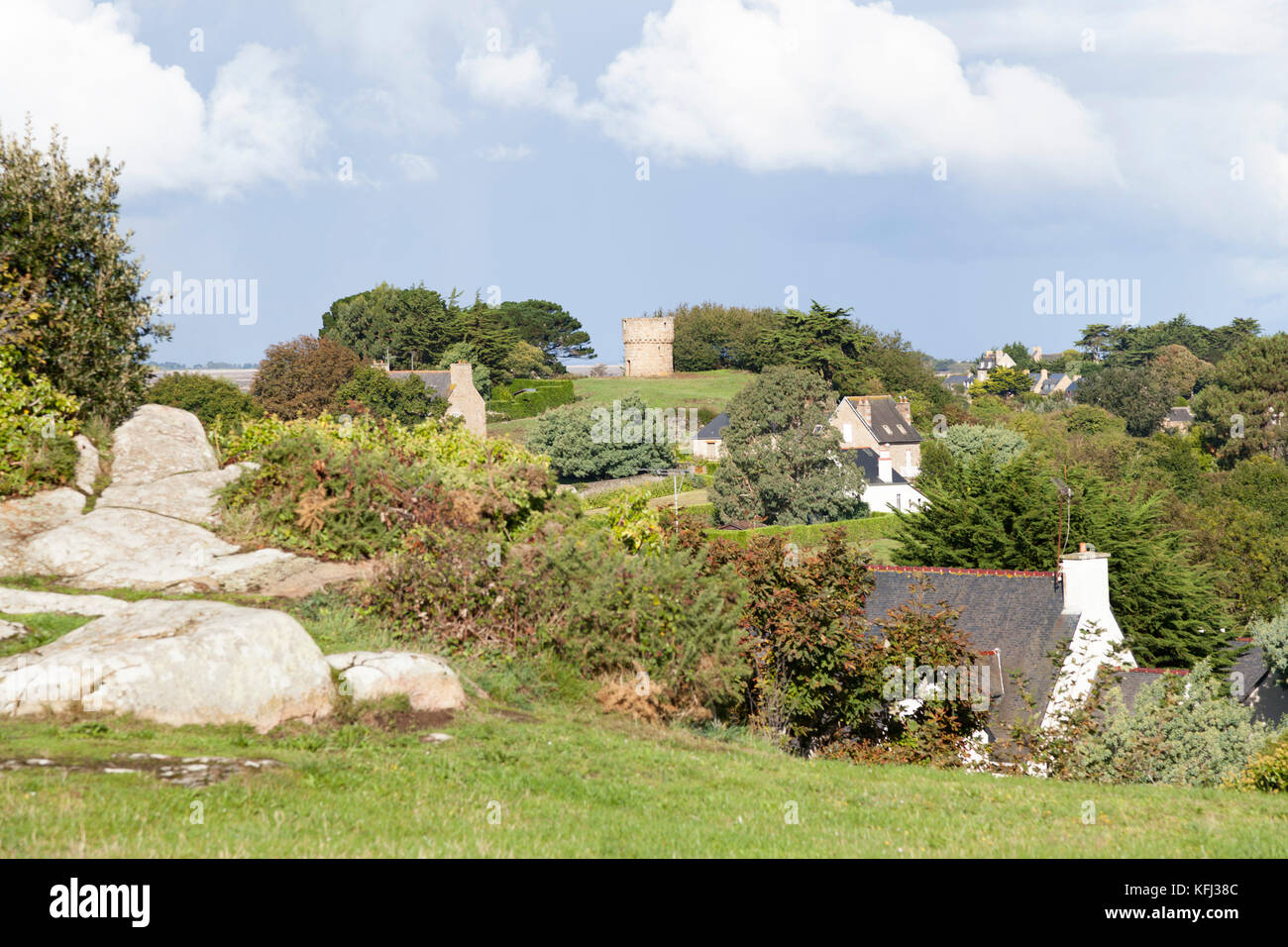A view on houses of Brehat island (France). If the Brehat housing lacks unity it uses plentifully a quality local material: the pink granite. Stock Photo