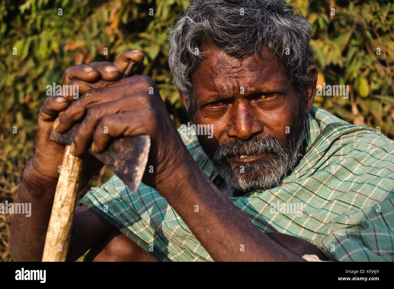Hindu man from a low caste on his way to the forest to cut firewood ( Niyamgiri hills, India) Stock Photo