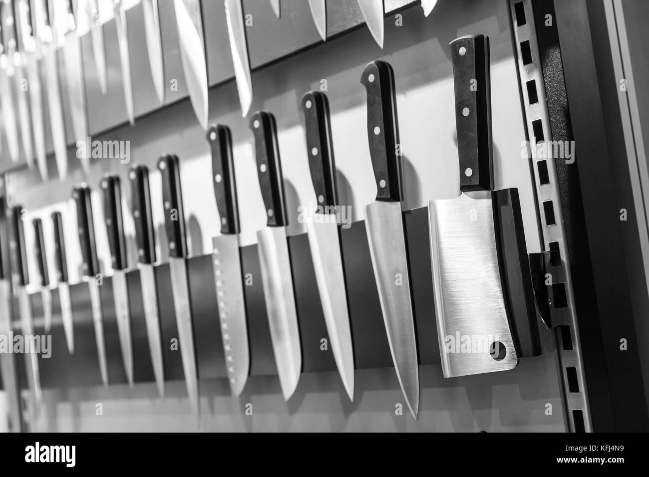 Kitchen knives collection on holder closeup. Cooking equipment