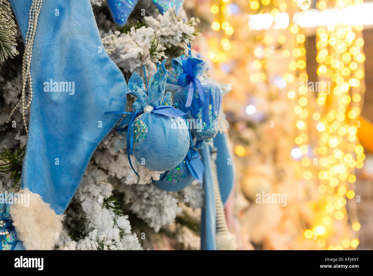Christmas tree decorated with blue balls and lights, garland closeup ...