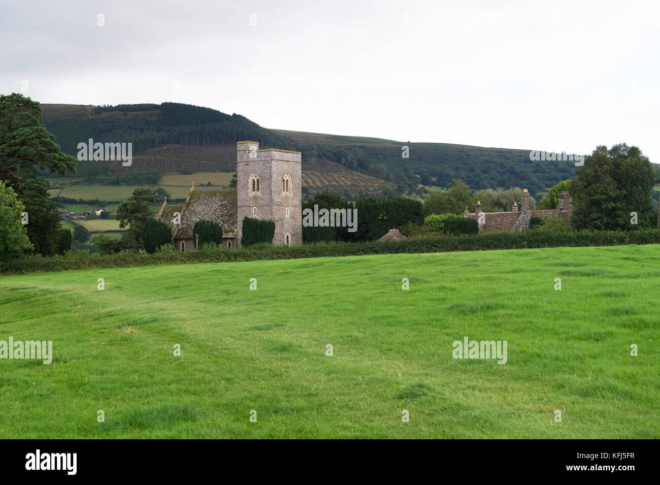 St Gastyn's Church at Llangasty Talyllyn, close to the shore of Llangorse Lake seen in the distance. Stock Photo