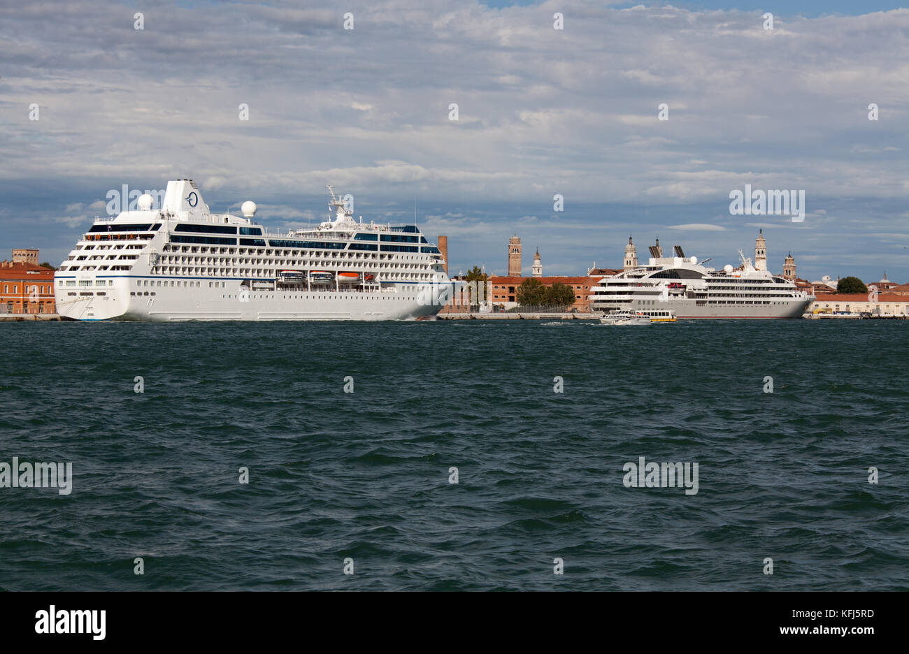 City of Venice Italy. Picturesque view of the cruise ship MS Serina berthed at Venice’s San Basilio cruise terminal. Stock Photo