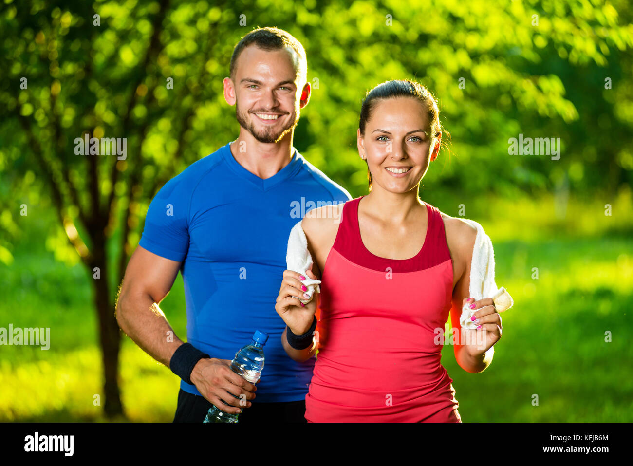 Athletic man and woman after fitness exercise Stock Photo