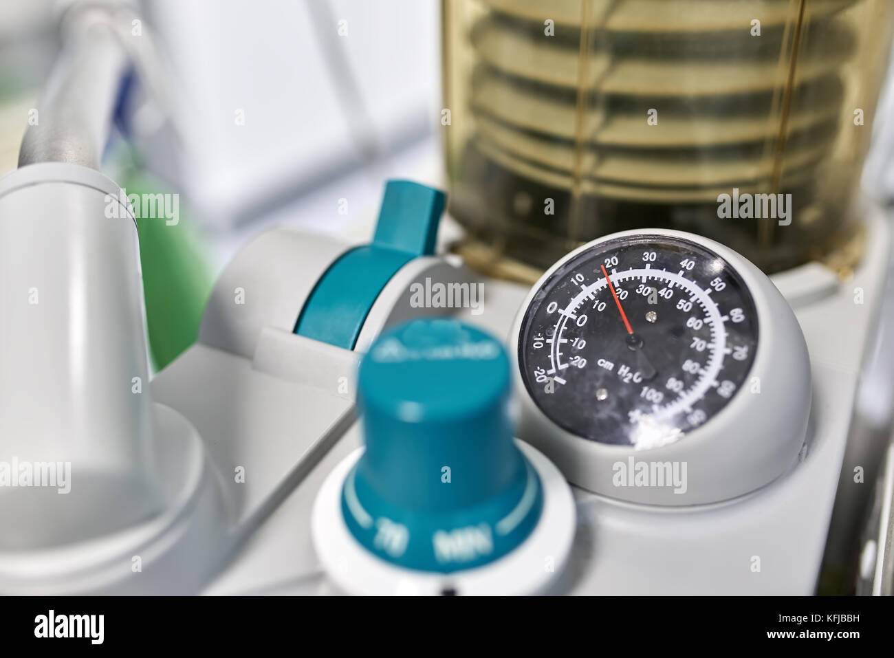 Closeup photo of parts of the anesthesia machine. There is a round