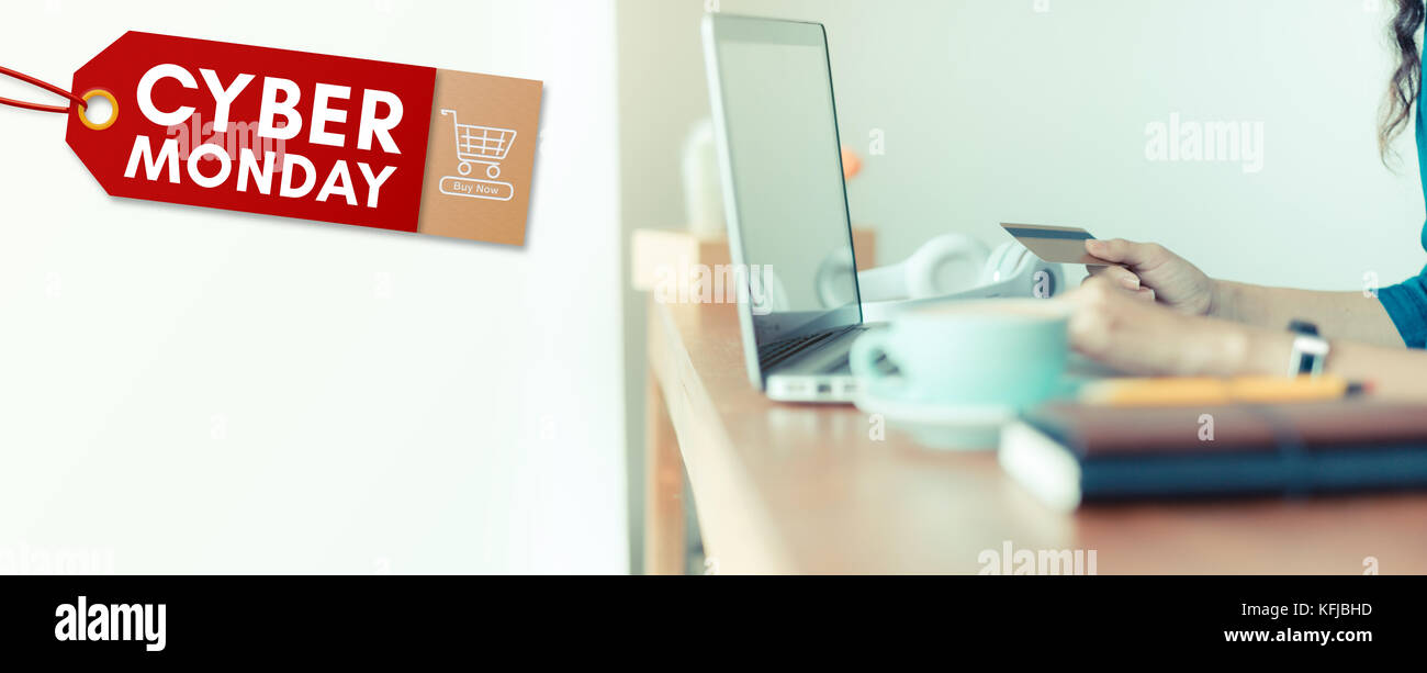Cyber Monday sale tag banner with woman holding credit card use laptop computer to shopping online at cafe,Digital marketing promotion concept,Leave s Stock Photo