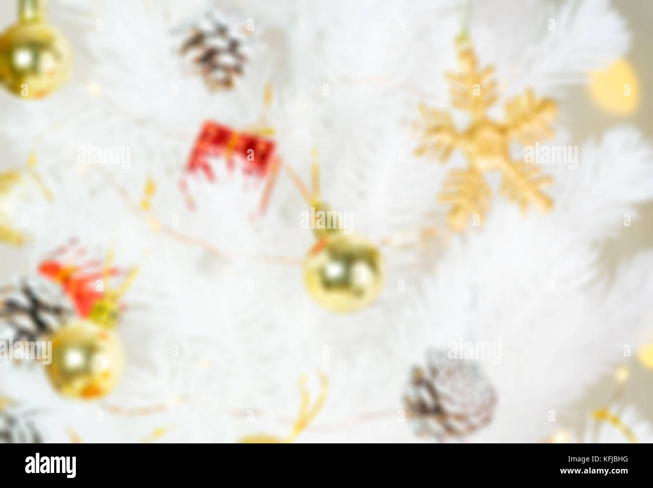 Blur background of Christmas decoration object hanging on white xmas tree,Holiday season Stock Photo