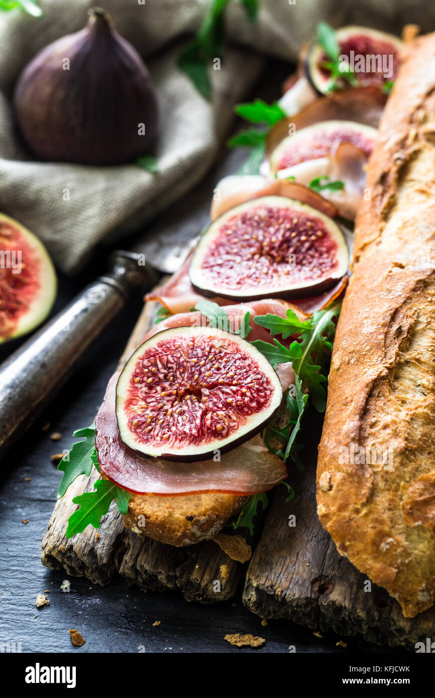 Sandwich with figs and prosciutto Stock Photo Alamy