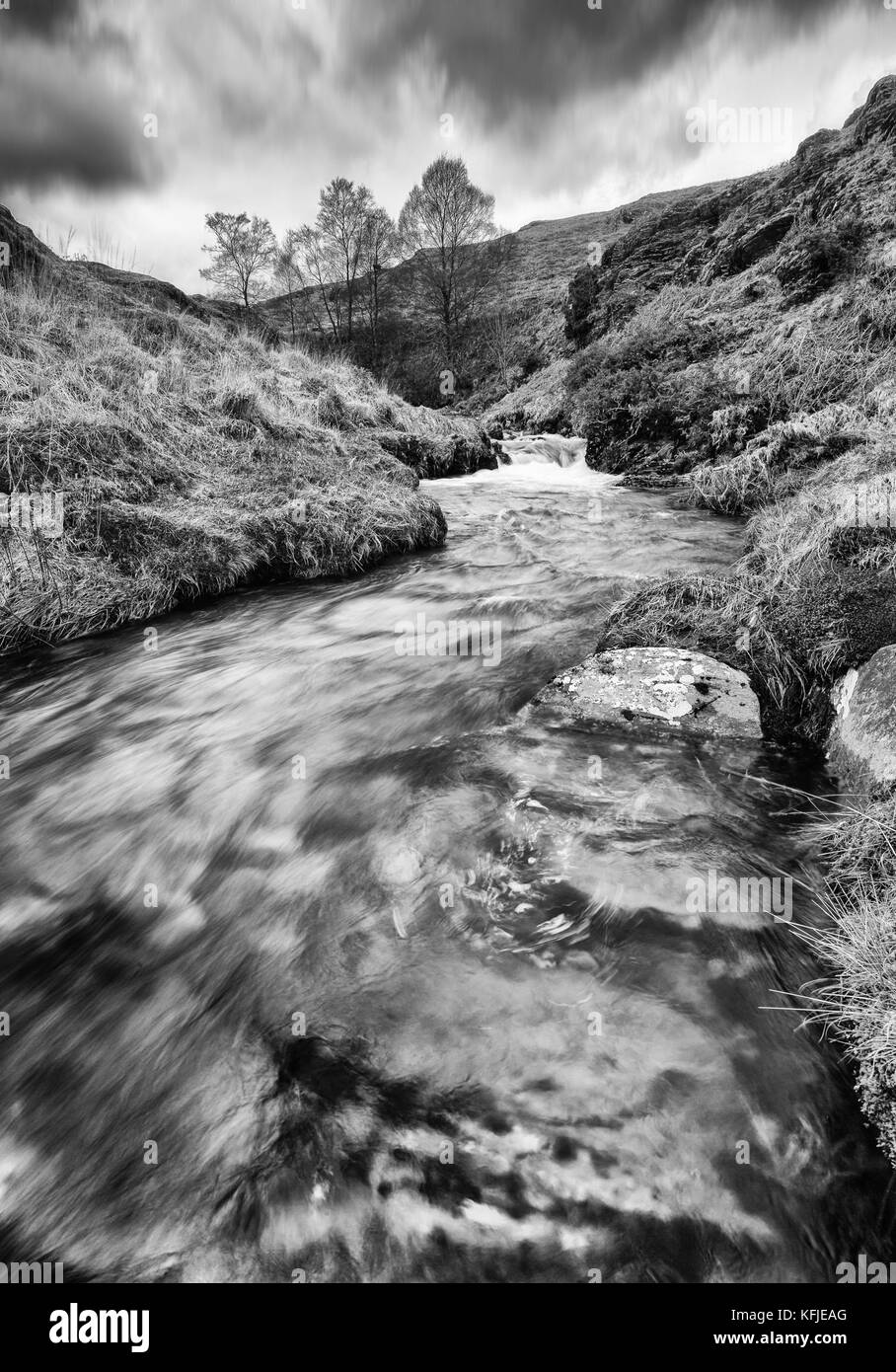 Small stream in dramatic Black and White in the Elan valley, Wales Stock Photo