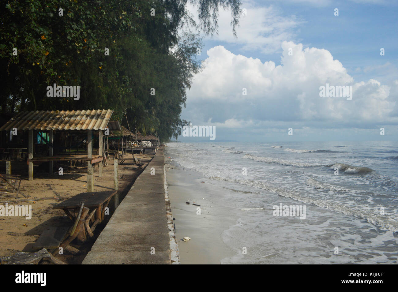 Remote beach in Cambodia, Kep. Deserted. Nature with a small hut on the beach and a stranded bottle. No people. Only dirty because of the current. Stock Photo