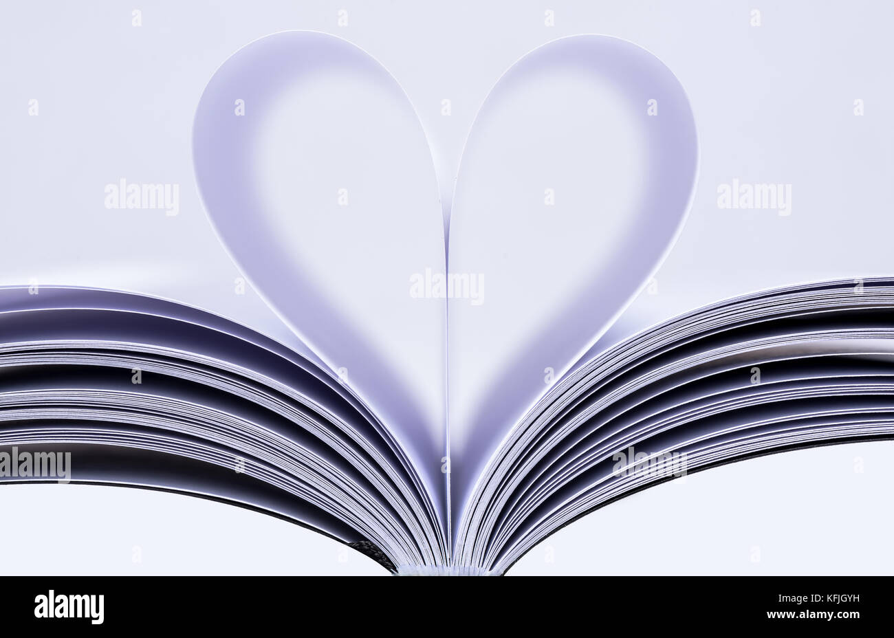 Heart Shaped Book. Book page in heart shape, focus on foreground Stock