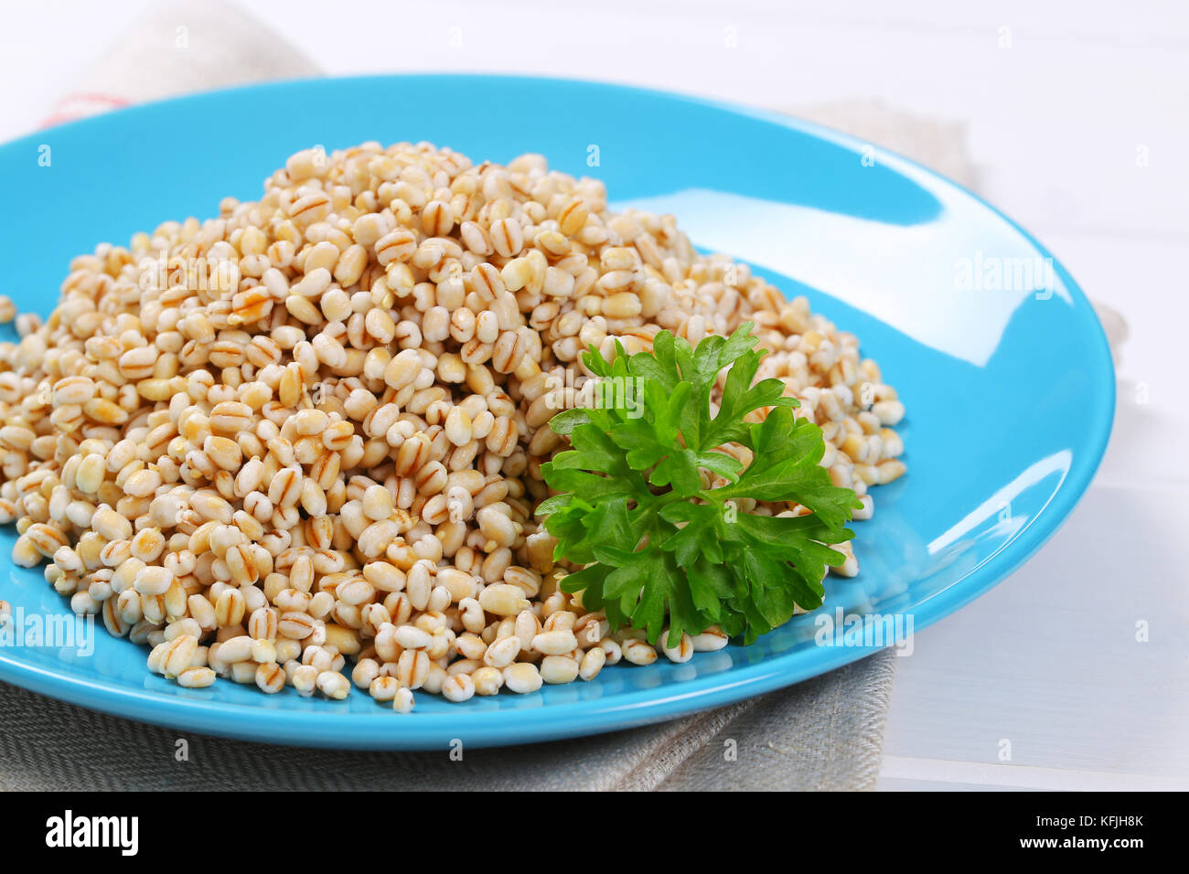 plate of cooked pearl barley - close up Stock Photo