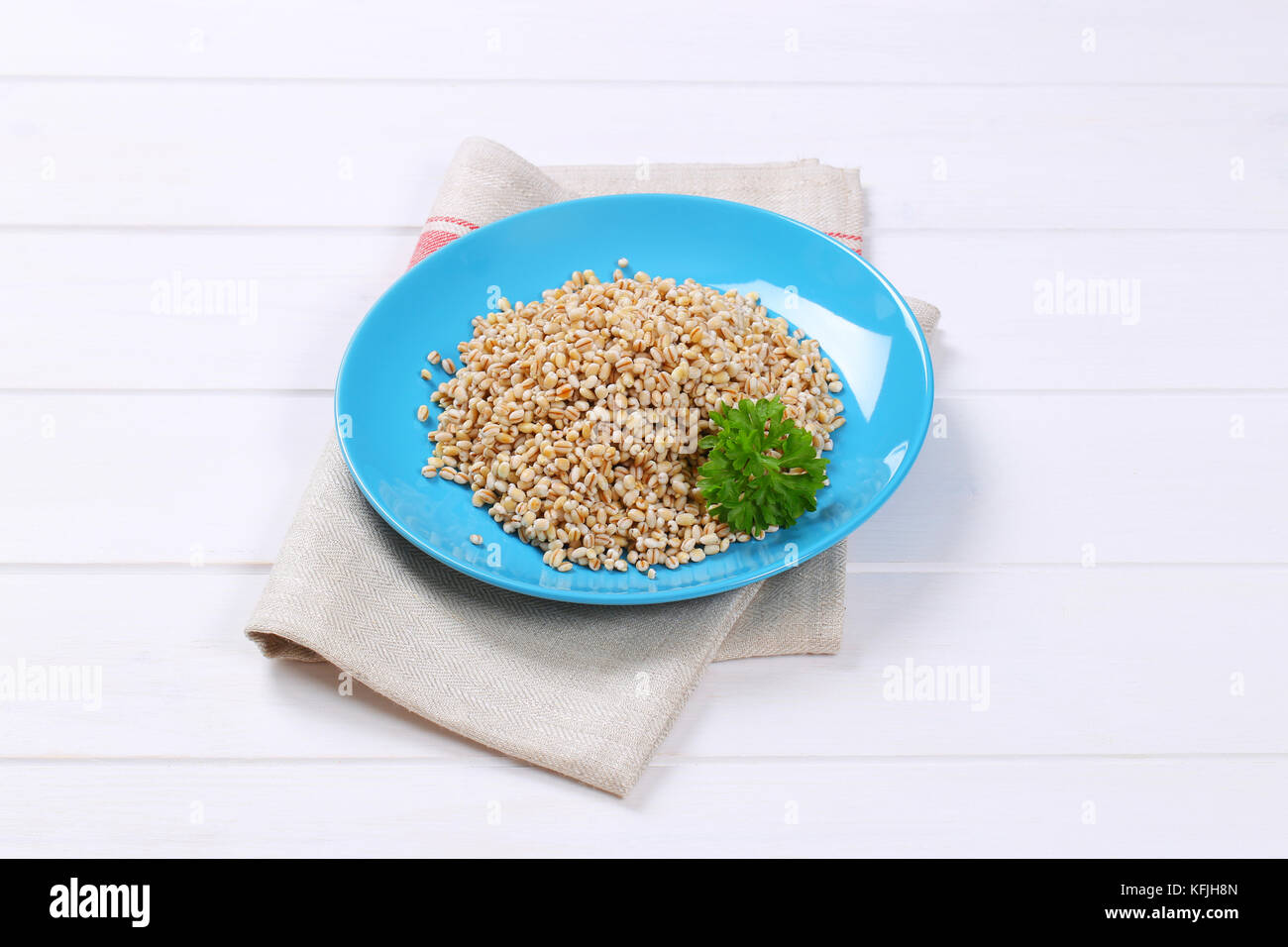 plate of cooked pearl barley on place mat Stock Photo