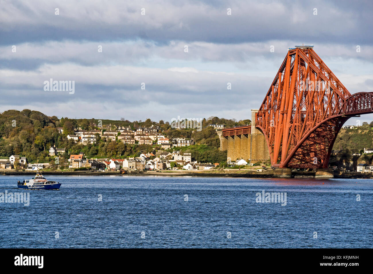 Forth Boat Tours Forth Belle heading towards South Queensferry pier on the Firth of Forth with North Queensferry and Forth Bridge in Scotland UK Stock Photo