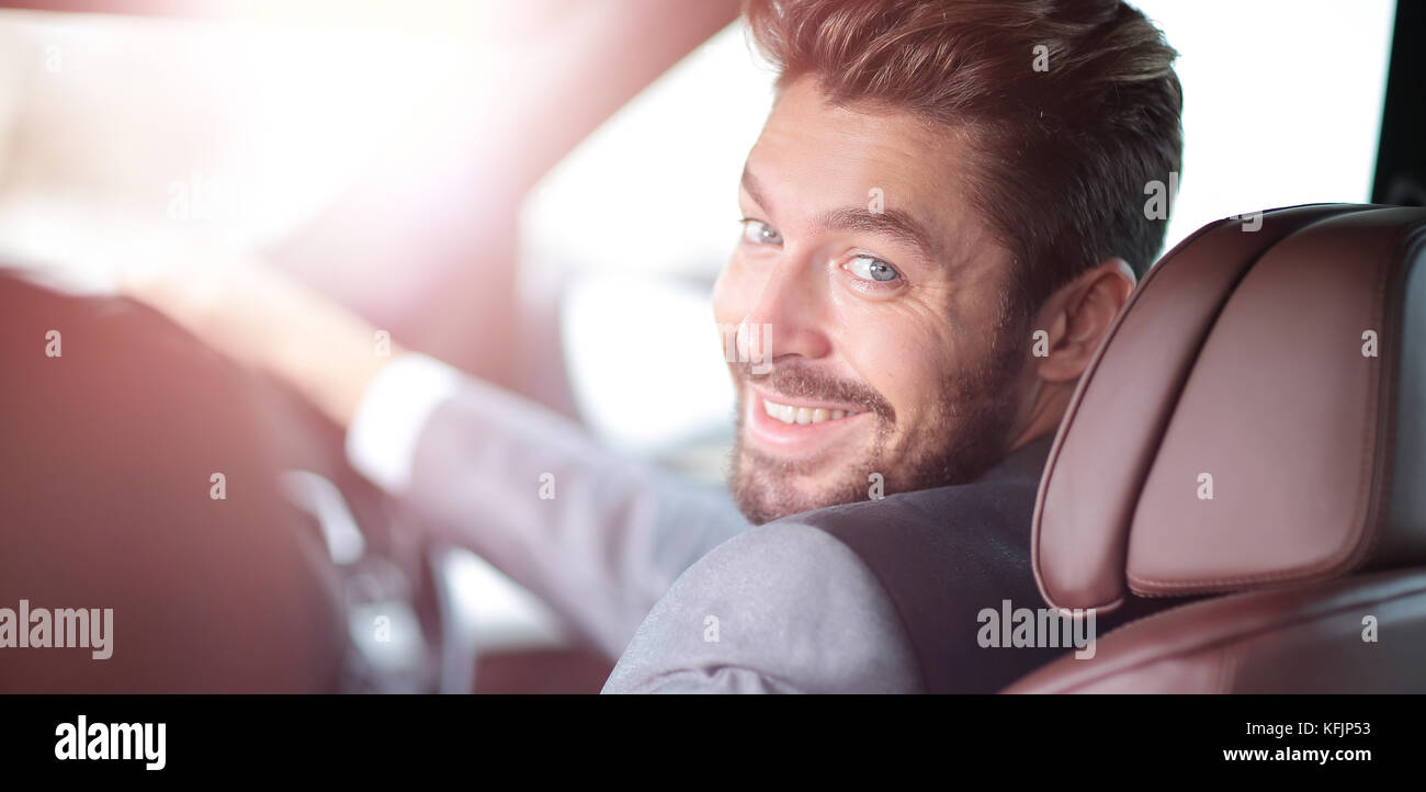 Portrait of an handsome smiling business man driving his car Stock ...