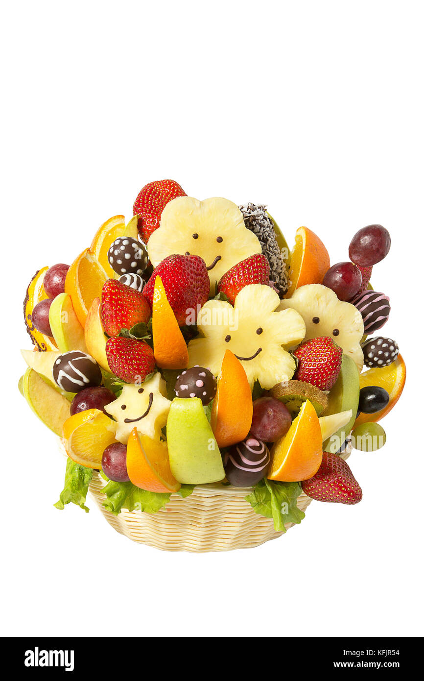 Basket with fruits and berries in chocolate isolated on white