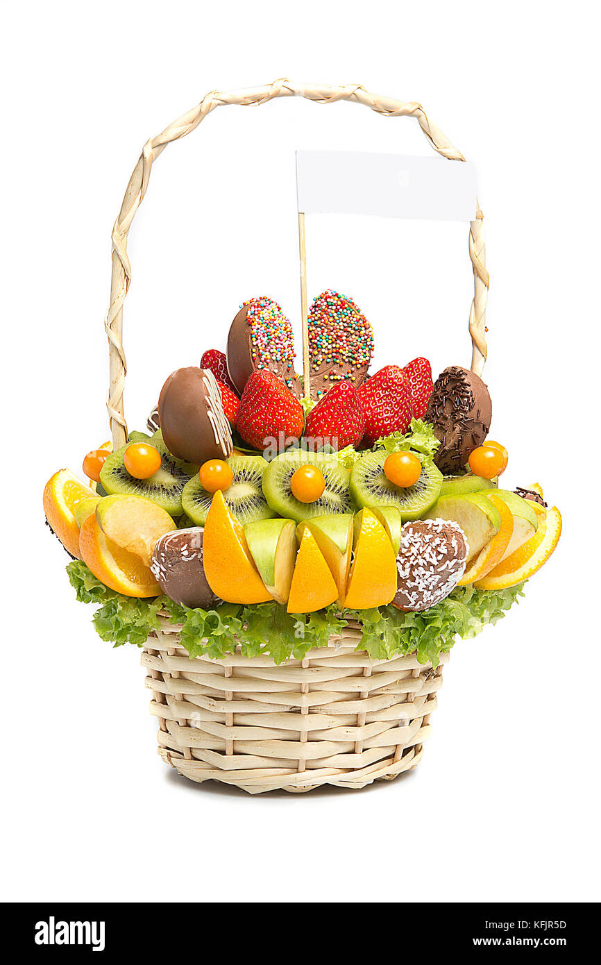 Basket with fruits and berries in chocolate isolated on white