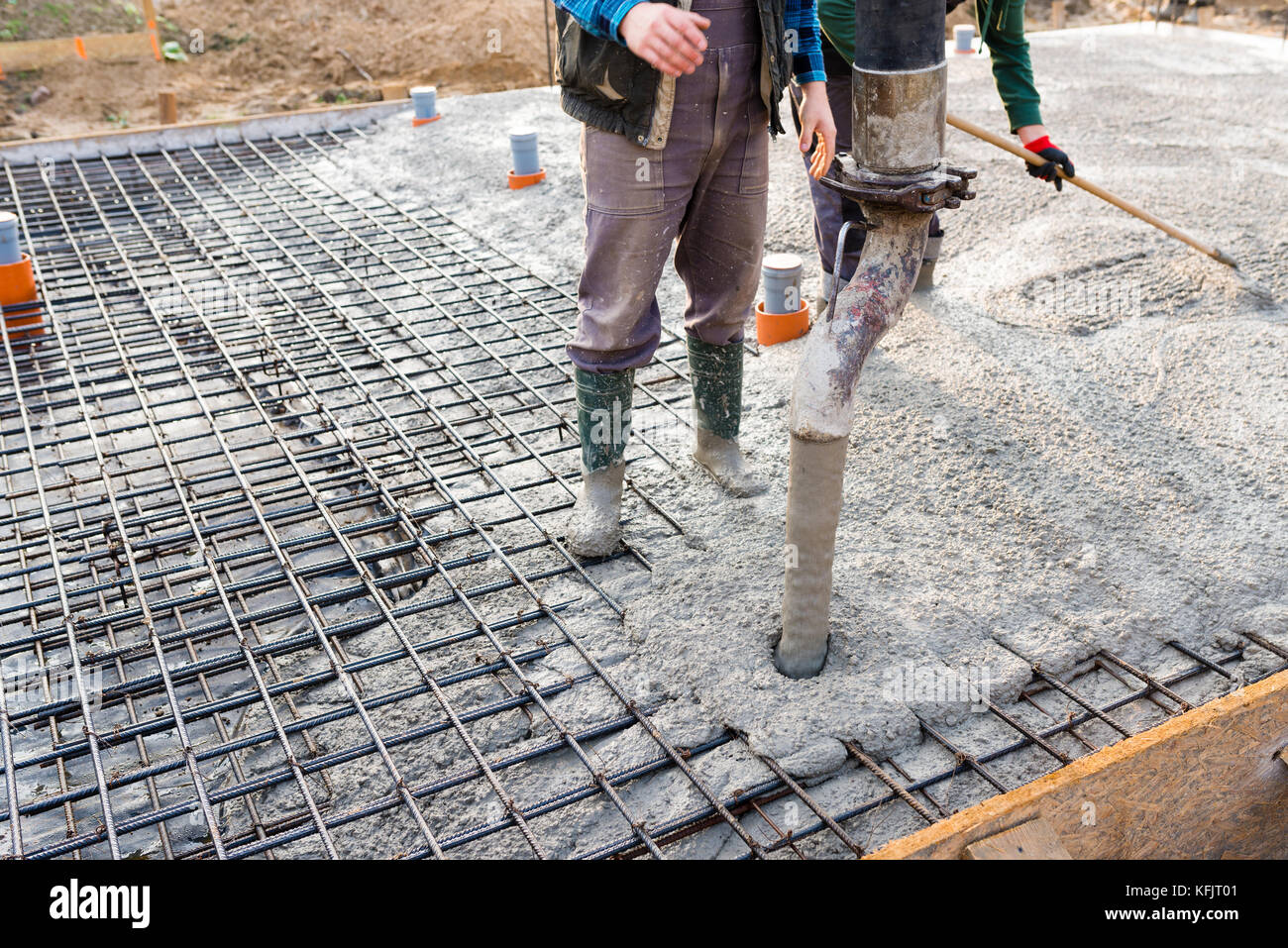 pouring concrete slab - concrete pouring during commercial concreting 