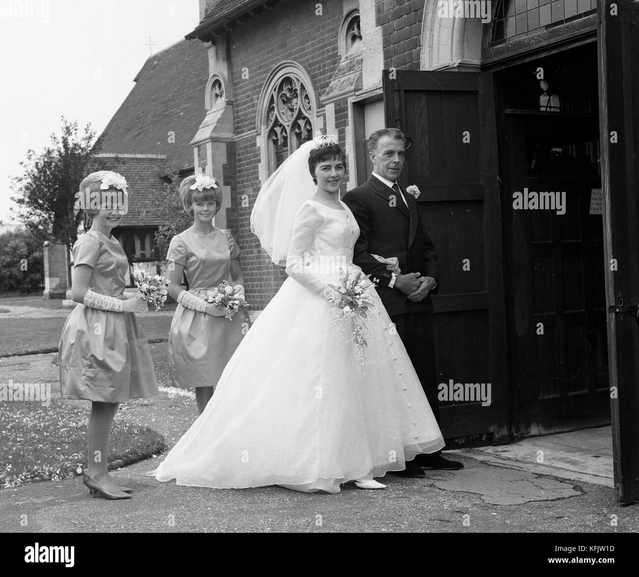 The Bride about to enter the church with her father and Bridesmaids